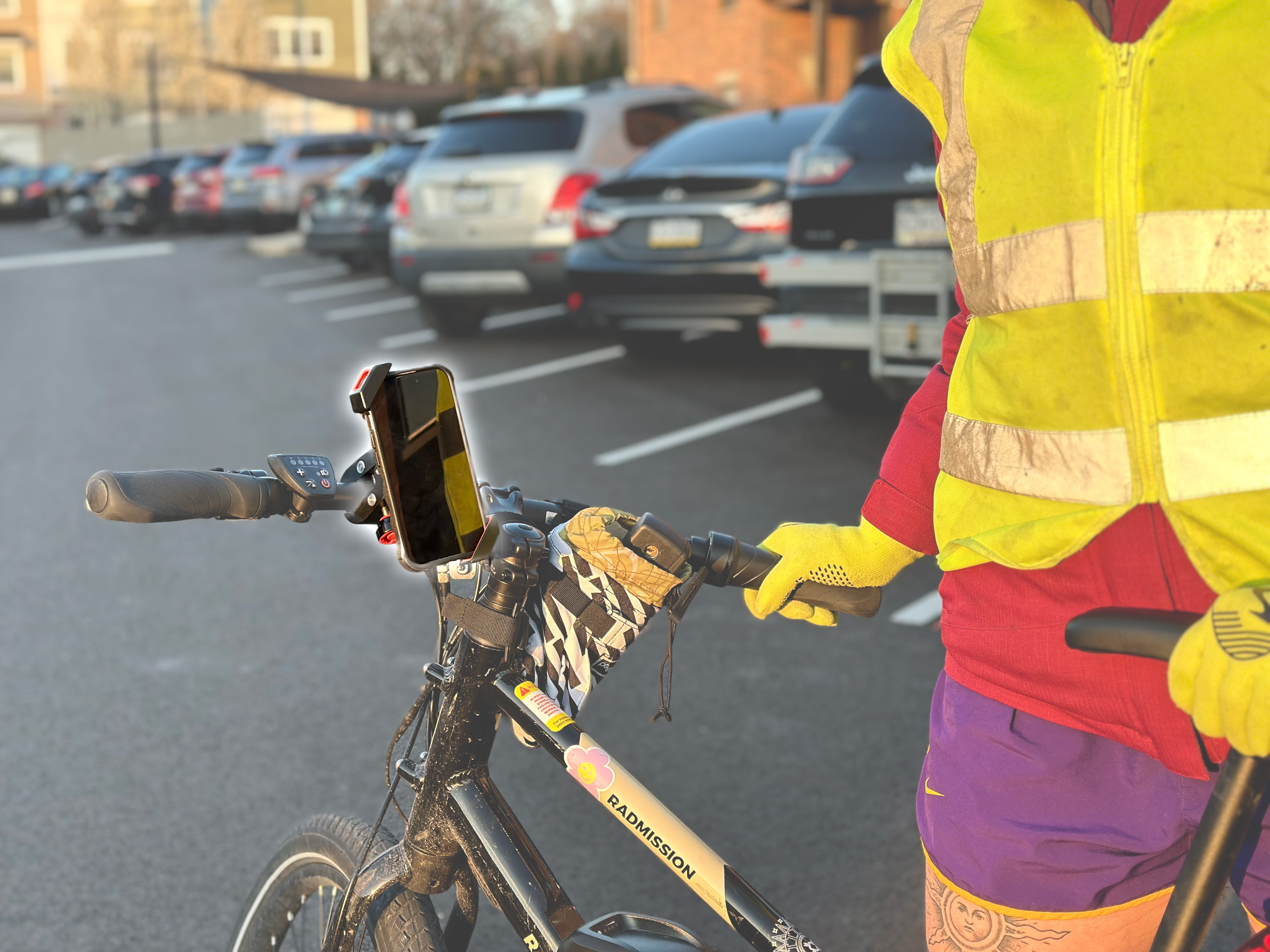 A phone mounted on bicycle handlebars